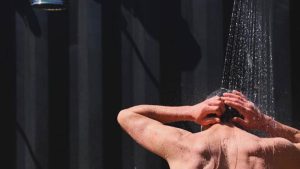 Man-taking-a-water-shower